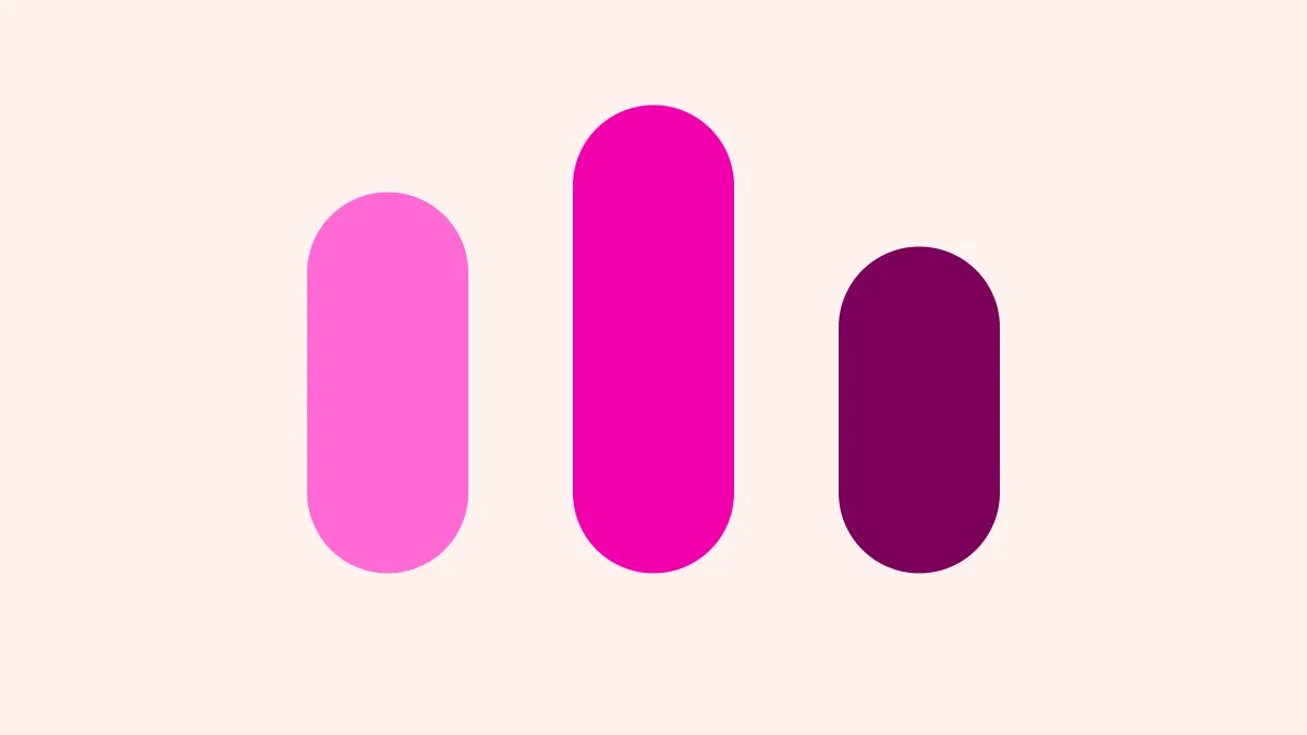Three rounded magenta pillars of different heights, tallest in the middle, on a creamy ground.