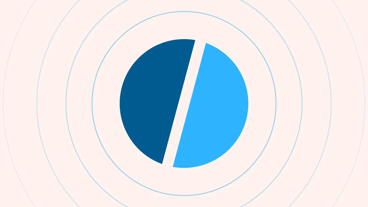 A circle split by a diagonal seam into a dark and a light azure half, inside thin concentric rings, on a creamy ground.