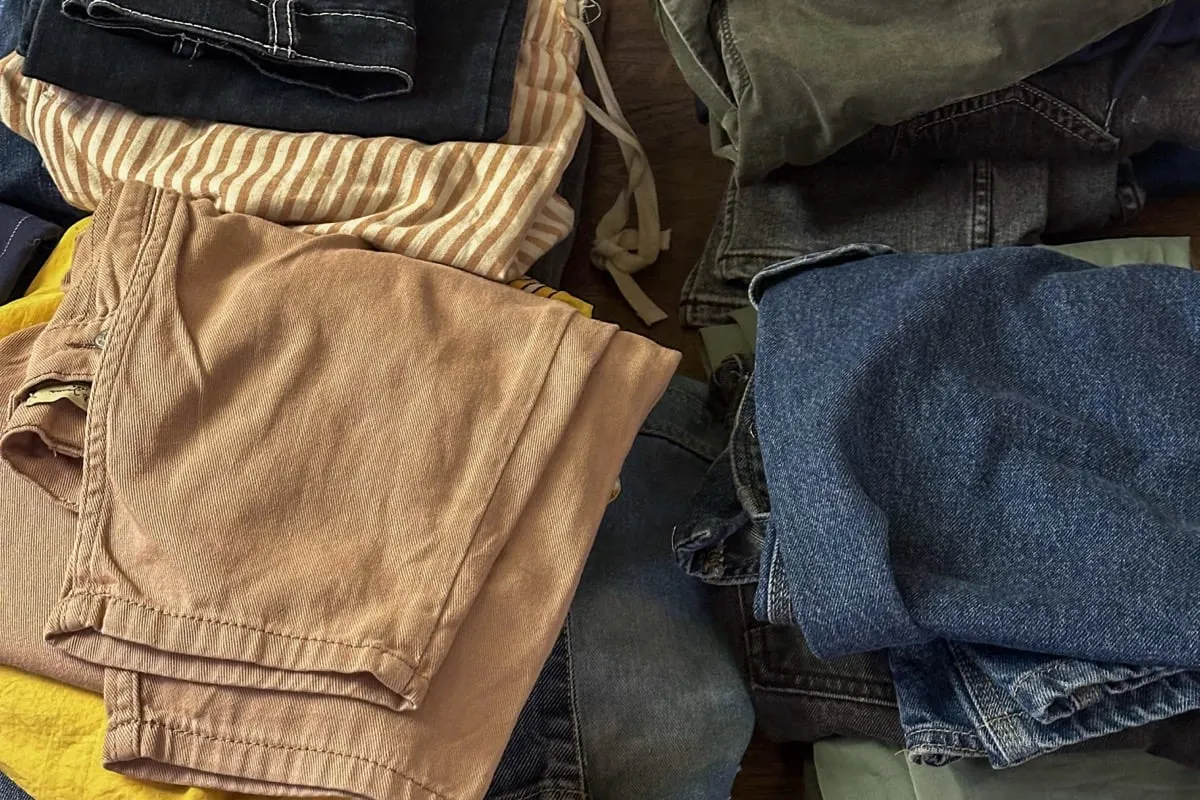 Stack of folded jeans on the table